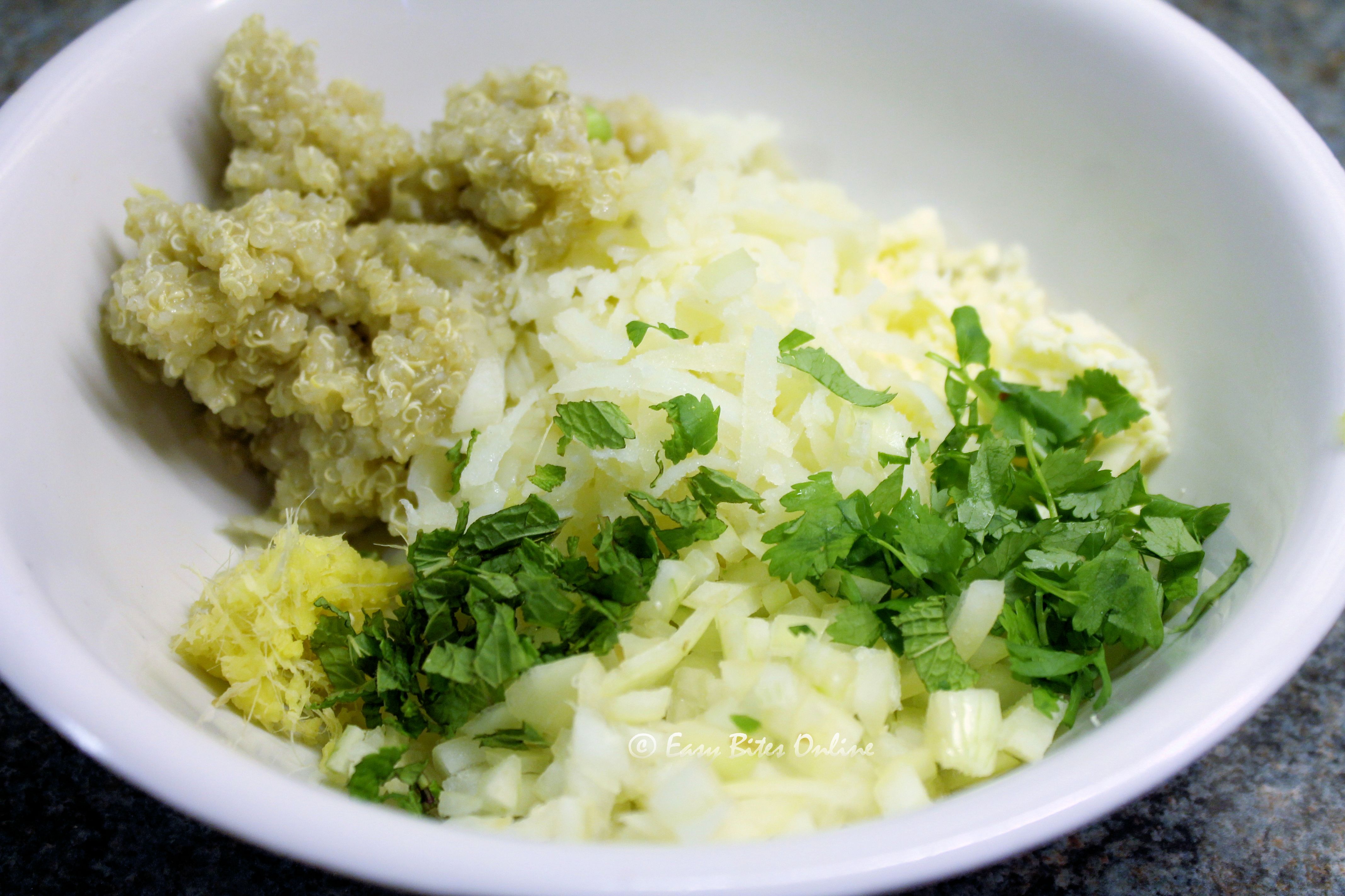 add quinoa, potato, paneer, onion, ginger, garlic, salt and pepper to a bowl (1)