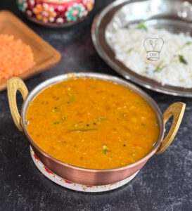 Kashmiri chilli powder adding vibrant red color to dal