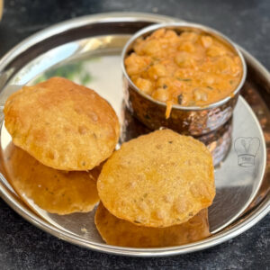Crispy fried puris served hot with curry