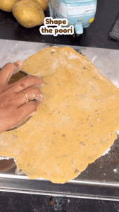 Small poori dough discs ready for frying