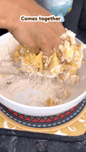 Poori dough mixture being combined in a bowl