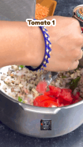 Tomato and spices cooking until mushy