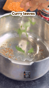 Adding curry leaves and spices to cooker